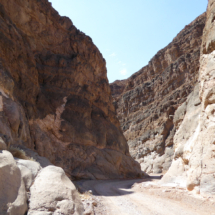 Titus Canyon Narrows, Death Valley National Park, 2016. Thunderstorms in Titus Canyon result in flash floods through the narrows with water 30' deep. Every time, the road must be rebuilt. Titus Canyon Narrows, Death Valley National Park, Vince Pitelka, 2016