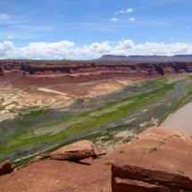 Colorado River, looking downstream from Hite Overlook, Glen Canon Recreation Area, UT, 2016, white area in center left is the Hite Marina boat ramp, once on the shore of Lake Powell, now a huge, useless, inclined slab of concrete a half mile from the river. Colorado River, looking downstream from Hite Overlook, Glen Canon Recreation Area, UT, Vince Pitelka, 2016, concrete slab left of center is Hite Marina Boat Ramp