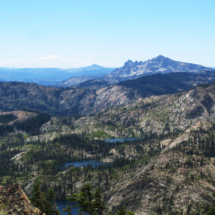 View of Lakes Basin from summit of Mount Elwell, Lakes Basin Recreation Area, CA, 2015, Sierra Buttes right of center, English Mountain left of center, High Sierra west of Lake Tahoe in the far left distance. View of Lakes Basin from Summit of Mount Elwell, Lakes Basin Recreation Area, CA, Vince Pitelka, 2015