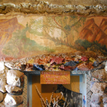 Sign reads, "Stone Paintings by Ravenwing, Sioux Princess," World's Wonder View Tower, Genoa, Colorado Painting by Sioux Princess Ravenwing, Worlds Wonderview Tower, Genoa, CO, Vince Pitelka